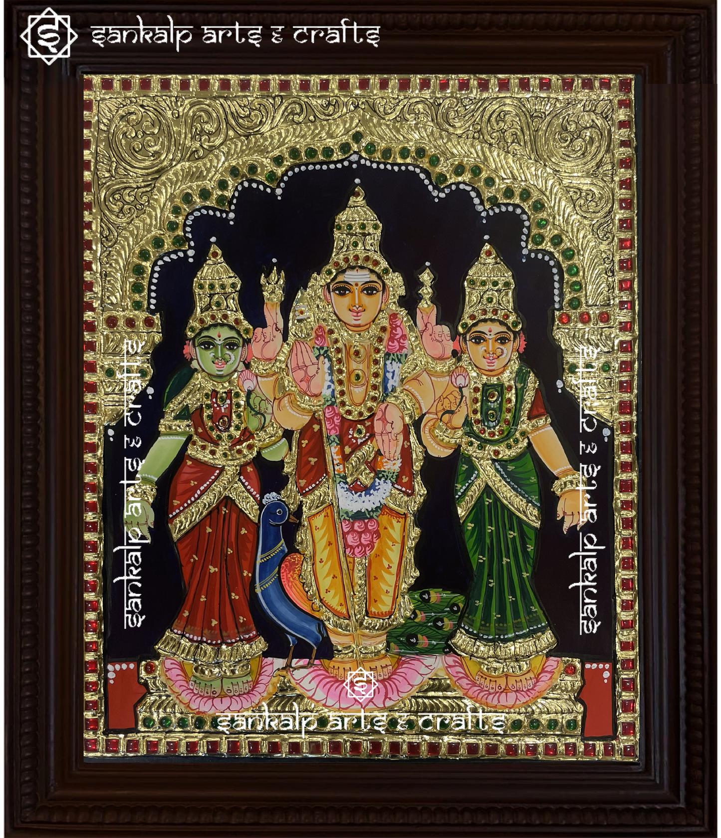 A beautifully framed Tanjore painting of Lord Murugan with Goddess Valli and Deivanai, adorned with rich gold foil work. A perfect spiritual decor piece for homes in Chennai & Bangalore.

