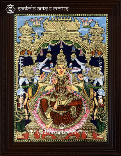 A stunning Raja Alangara Gajalakshmi Tanjore painting featuring Goddess Lakshmi with elephants, adorned in intricate gold foil work. Available in Chennai & Bangalore.

