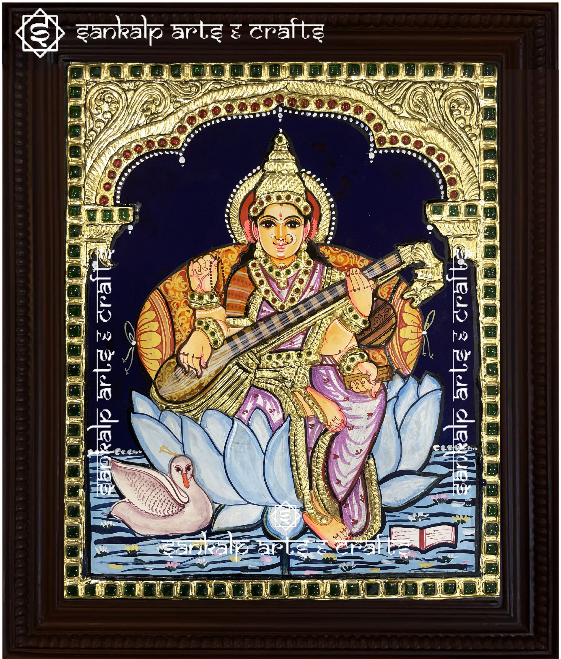 A beautifully handcrafted Saraswathi Tanjore painting depicting Goddess Saraswati, the goddess of wisdom and knowledge, adorned with intricate gold foil detailing and vibrant colors. This artwork symbolizes enlightenment, creativity, and spiritual growth.

