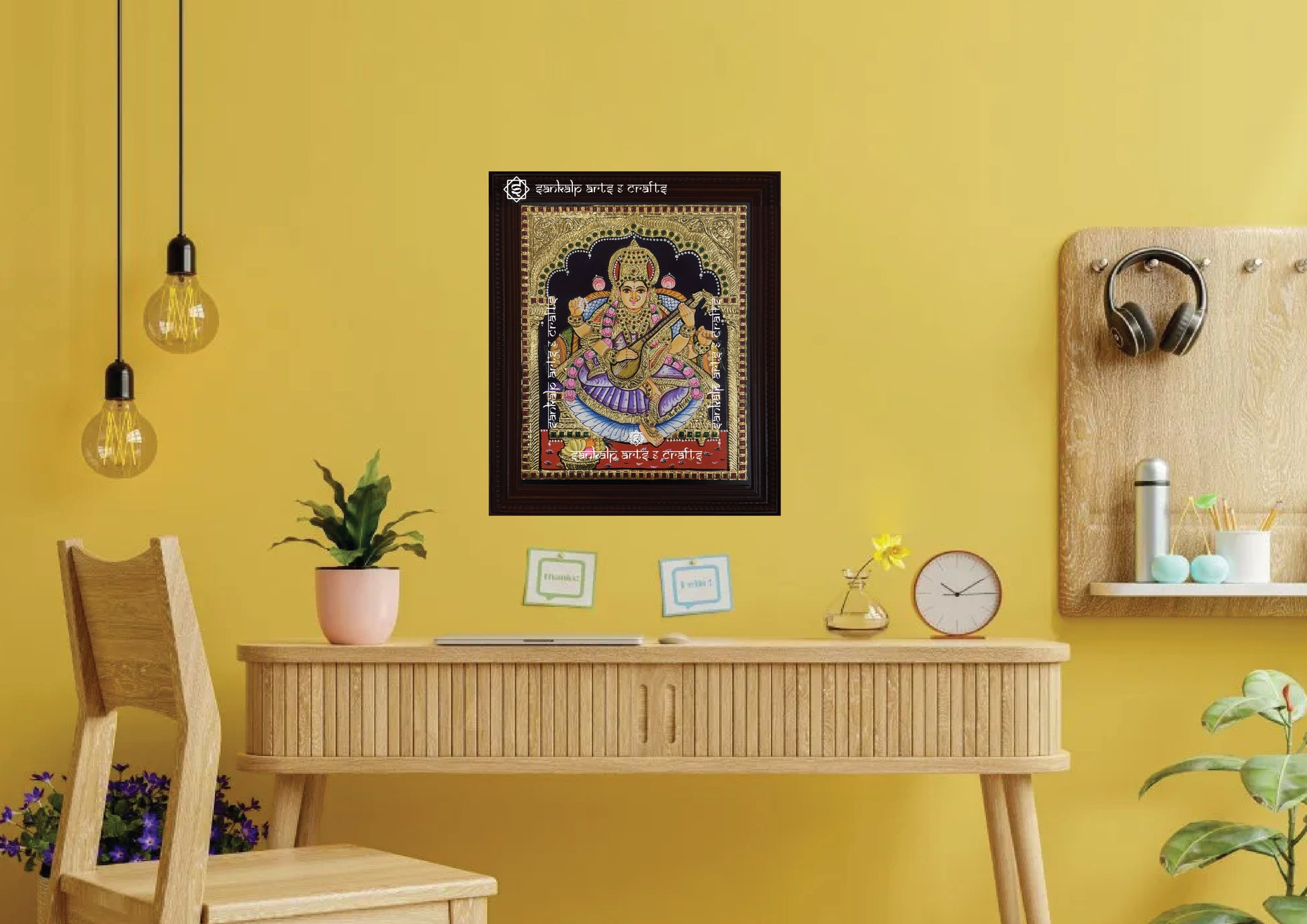 A framed Saraswati Tanjore painting, radiating divine energy with intricate gold work and vibrant colors, perfect for bringing wisdom, peace, and spiritual elegance to your pooja room or living space.

