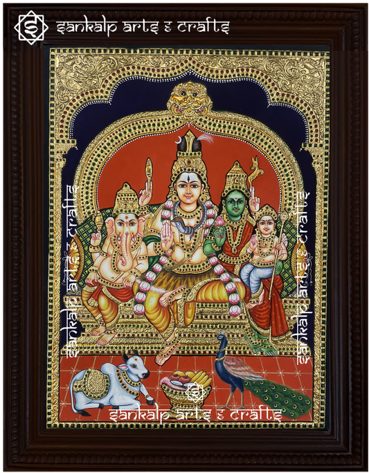 A beautifully framed Tanjore painting of Lord Shiva, Parvathi, Ganesha, and Murugan, adorned with gold foil detailing. Perfect sacred decor for Chennai & Bangalore.
