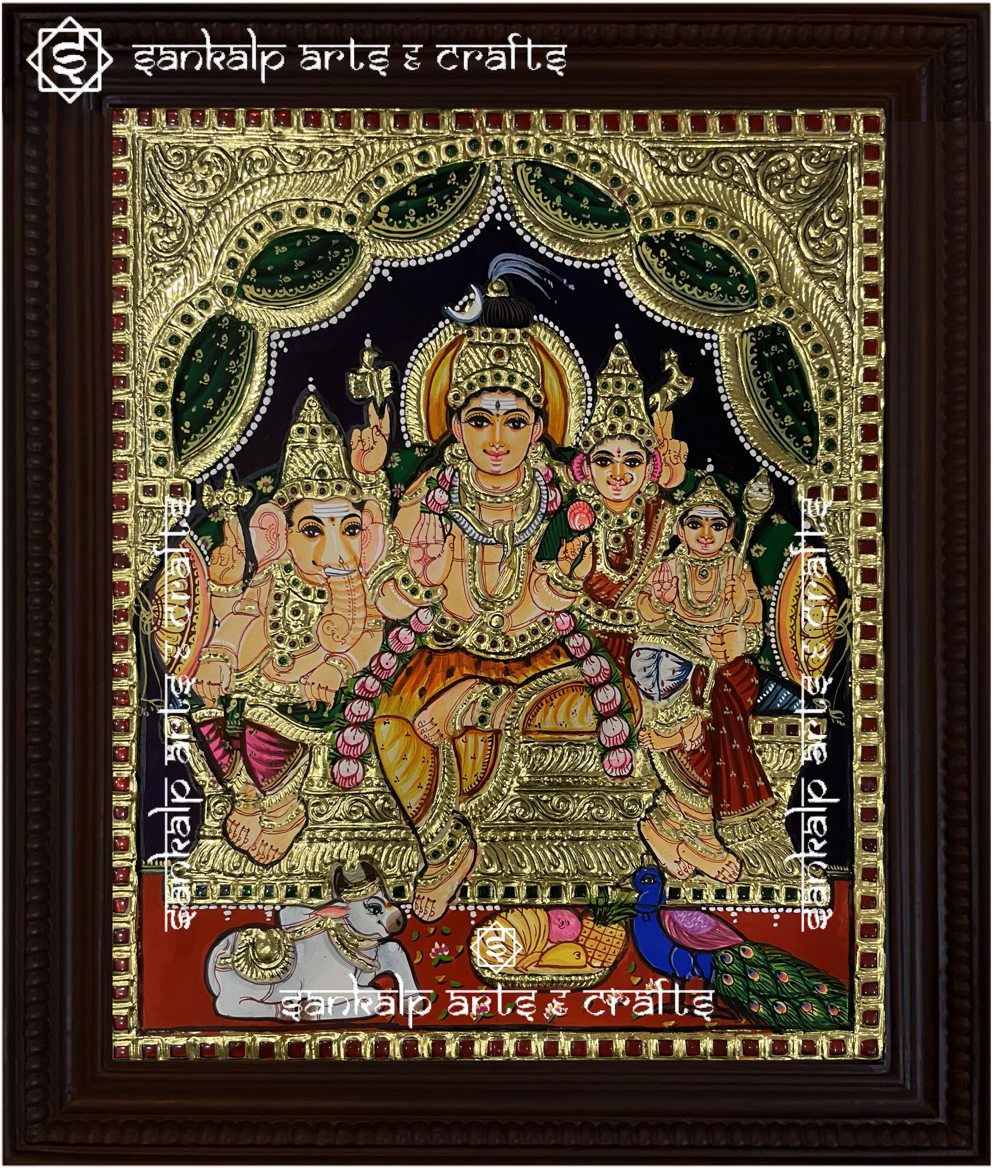 A beautifully framed Tanjore painting of Lord Shiva, Goddess Parvathi, and Lord Ganesha, adorned with intricate gold foil work. A perfect decor piece for homes in Chennai & Bangalore.

