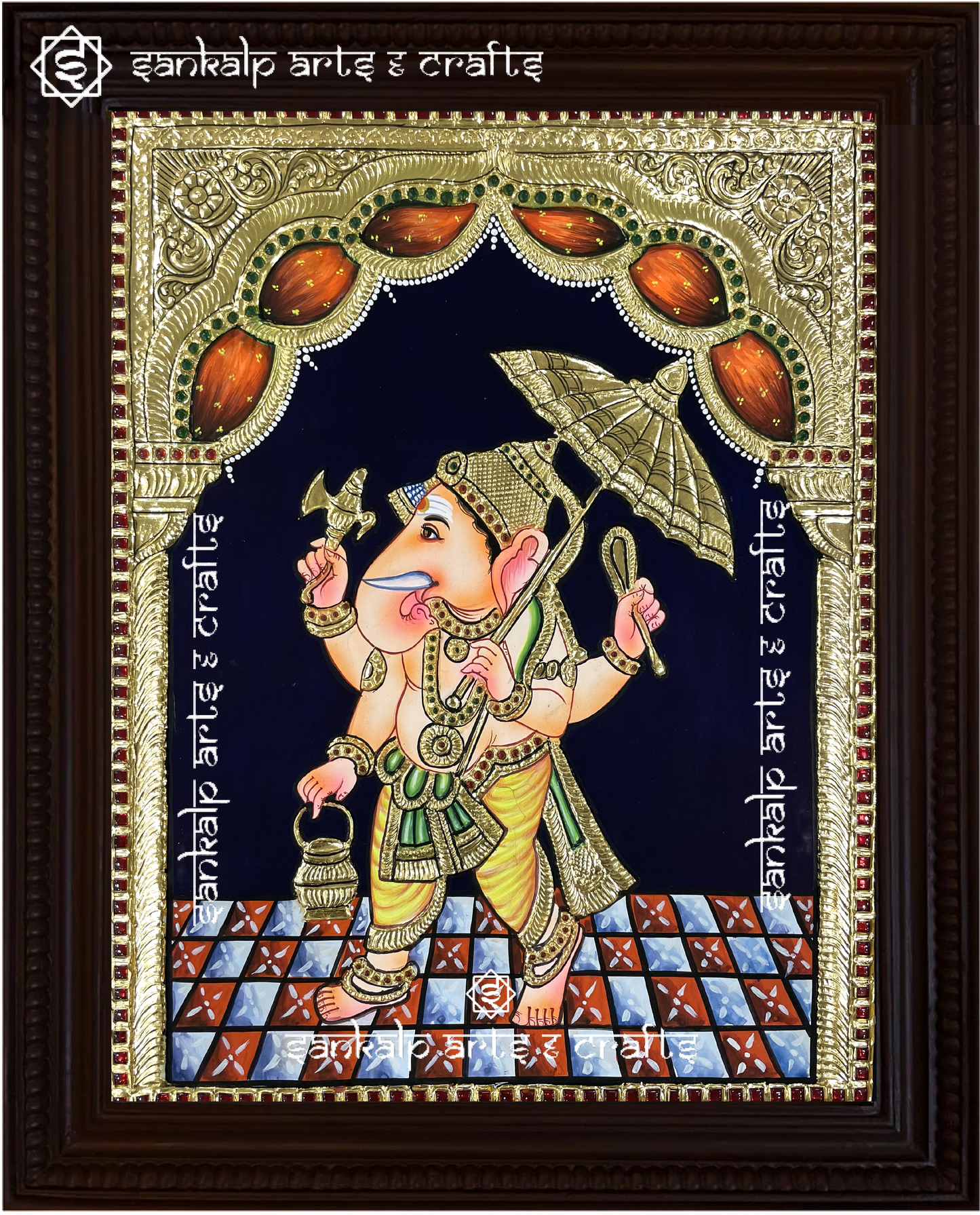 A close-up of the Umbrella Ganesha Tanjore painting, showcasing Lord Vinayagar in a majestic pose beneath a decorative umbrella, with exquisite gold foil work and vibrant hues. This traditional masterpiece is crafted with precision and is widely sought after in Chennai & Bangalore.


