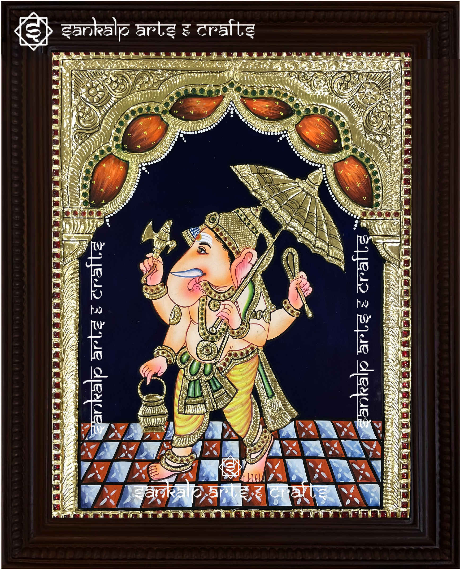 A close-up of the Umbrella Ganesha Tanjore painting, showcasing Lord Vinayagar in a majestic pose beneath a decorative umbrella, with exquisite gold foil work and vibrant hues. This traditional masterpiece is crafted with precision and is widely sought after in Chennai & Bangalore.

