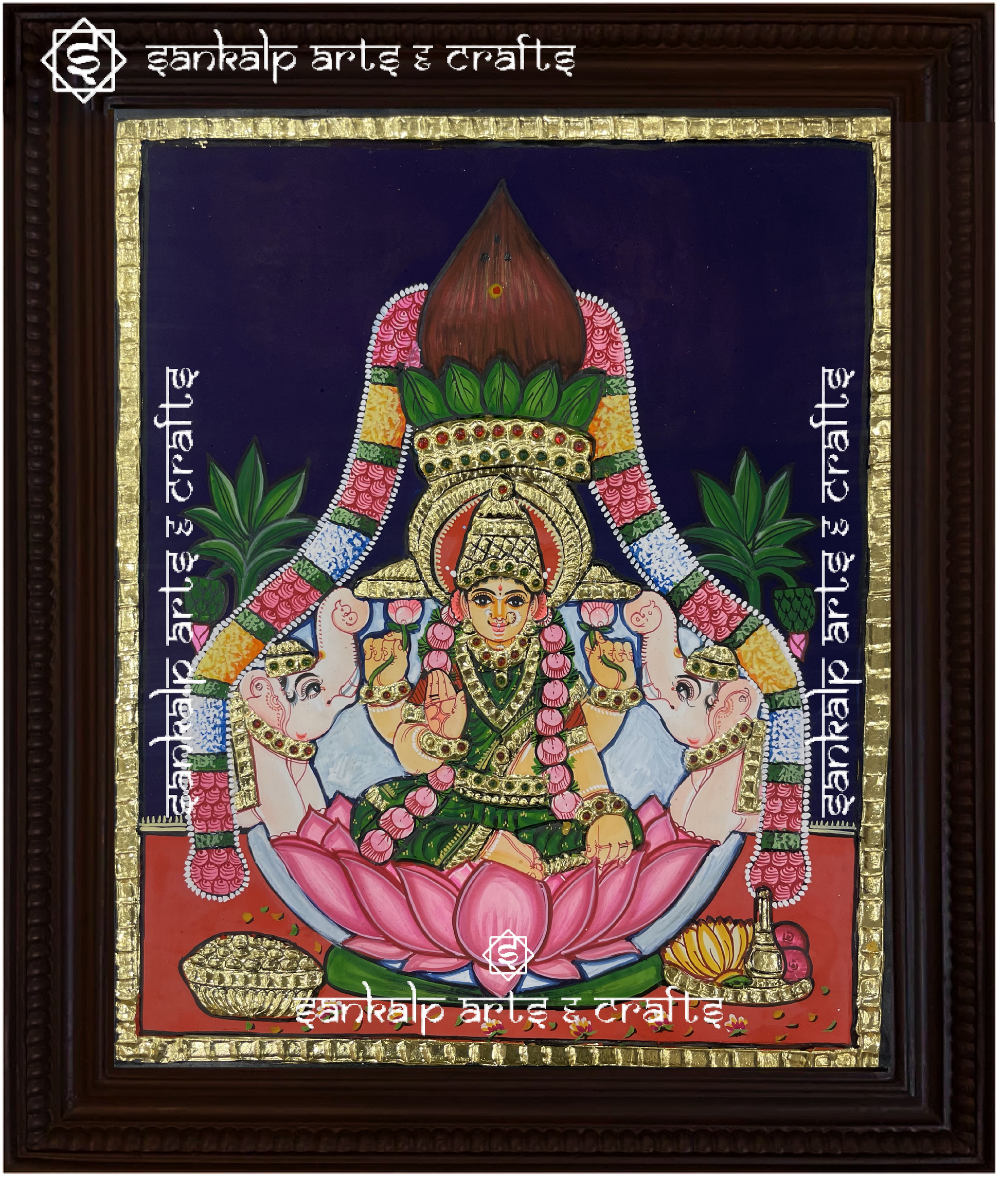 A beautifully framed Tanjore painting of Goddess Varamahalakshmi, adorned with rich gold foil work and vibrant colors. A perfect decor piece for homes in Chennai & Bangalore.